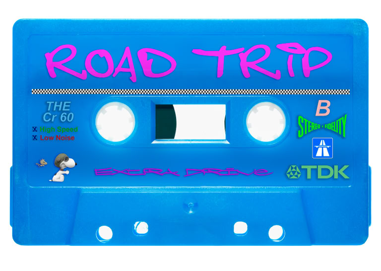 A blue cassette tape with "ROAD TRIP" written in pink at the top, featuring various logos and symbols, including a TDK logo.