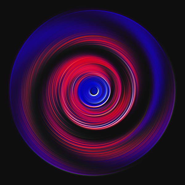 A swirling pattern of red and blue concentric circles on a black background.